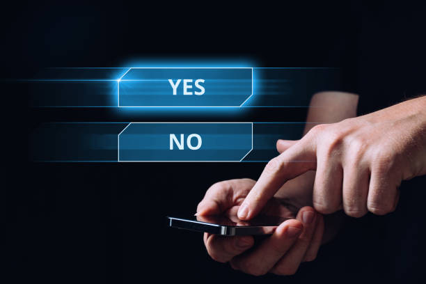 istock Choice concept with holographic yes or no buttons. Hand touching the display 1422998900
