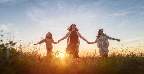 istock Happy family at sunset 1423000506