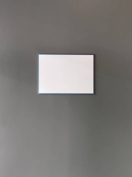 istock Empty placard or information board on the gray wall 1423001133