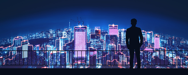 Metaverse crypto currency technology concept, Professional business man with blockchain network on futuristic neon city at night background in Tokyo, Japan