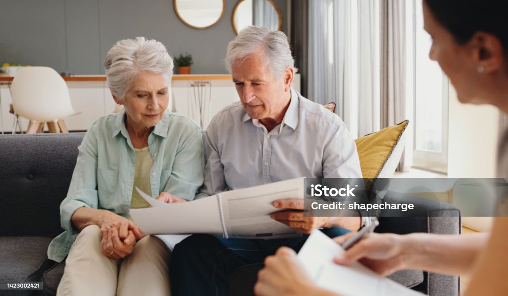 Senior couple writing will, inheritance and life insurance documents or contract with lawyer planning retirement. Pension fund, finance and financial investment with legal advisor for home mortgage Will - Legal Document Stock Photo