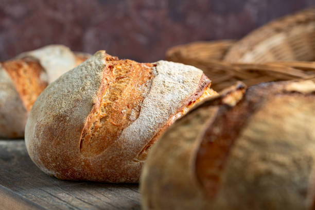 istock Artisanal sourdough bread on a wooden shelf. 1423002658