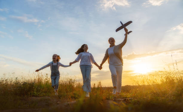 istock Happy family at sunset 1423004910