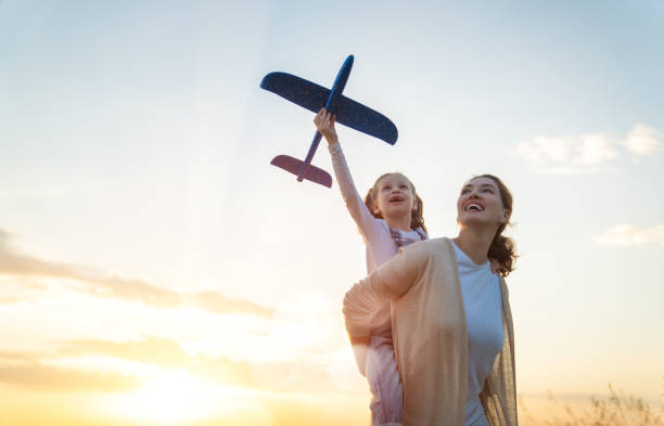 istock Happy family at sunset 1423004911
