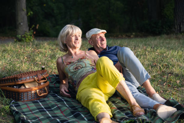 istock Senior couple having a great time together on a picnic 1423006277