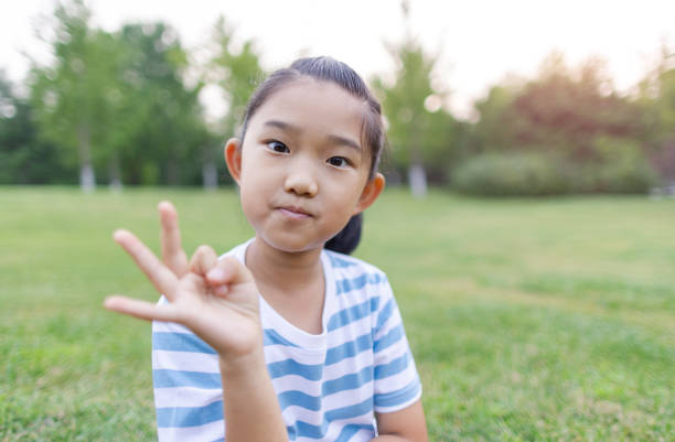 istock Little Girl Making OK Sign 1423007878
