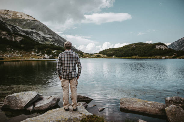 istock Relaxing near lake in the mountains 1423010661