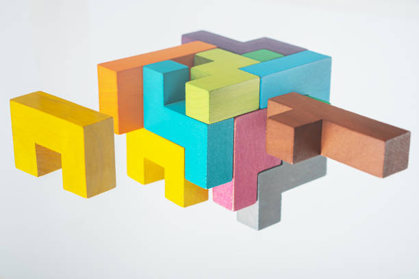 istock Abstract construction from wooden blocks. The concept of logical thinking. 1423011828