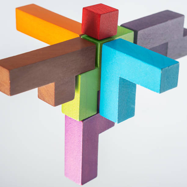 istock Abstract construction from wooden blocks. The concept of logical thinking. 1423011849