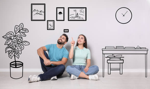 istock Happy couple dreaming about renovation on floor. Illustrated interior design 1423013113