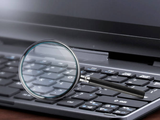 istock laptop computer with magnifying glass search concept 1423013329