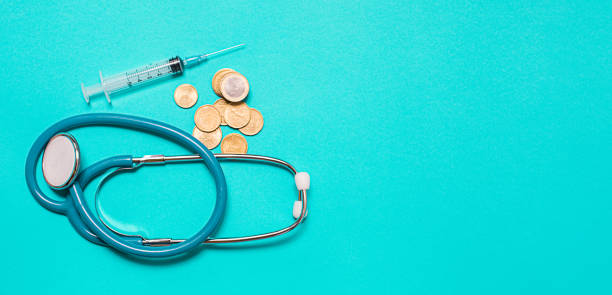 istock Syringe with vaccine on blue background from above 1423014371