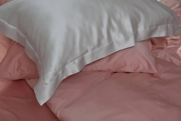 istock Closeup view of bed with beautiful silk linens 1423014548