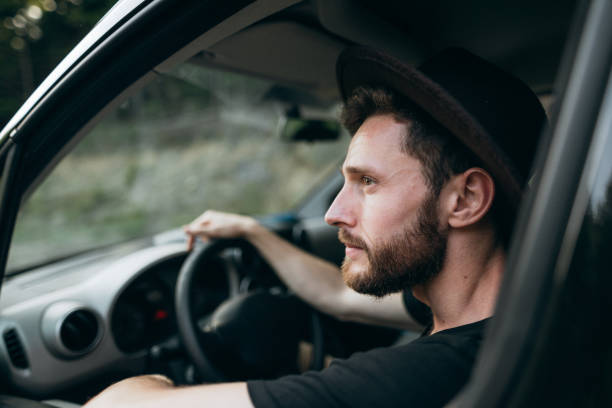 istock The handsome man driving his car 1423016222