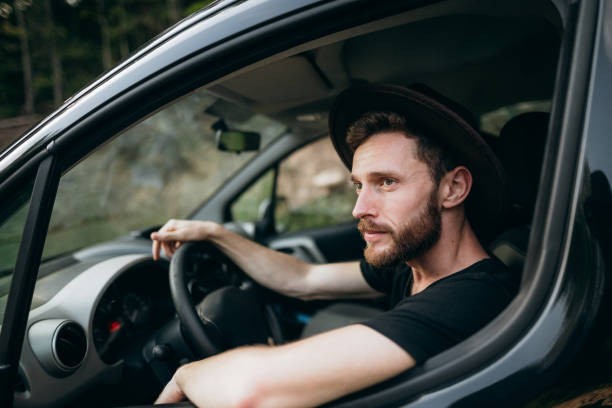 istock The handsome man driving his car 1423016491