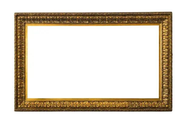 Photo of Antique wooden frame for paintings or photographs with gilding, isolated on a white background.