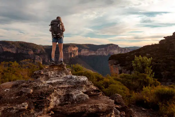 Photo of Hiking woman in mountain precipice with extraordinary views