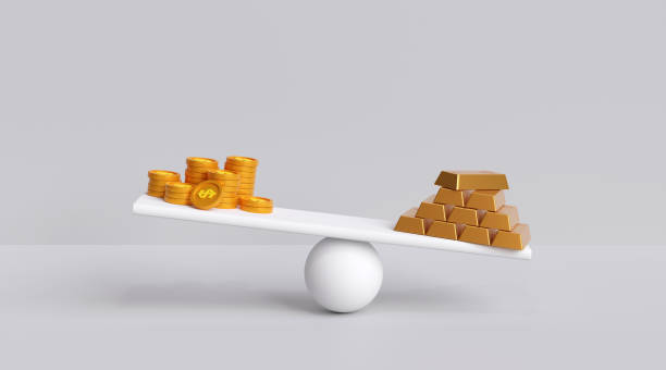 istock Dollar, gold coins vs gold bars on the scale, heavier gold weights. 1423021374