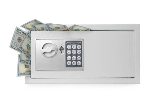 istock Steel safe with money on white background 1423021766