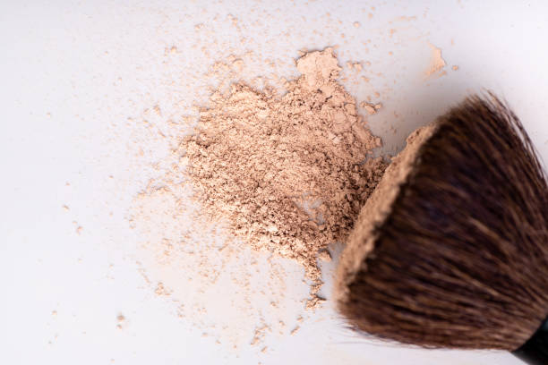 istock scattered skin colored powder on a light background 1423022126