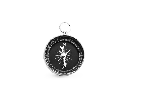 compass on gray background concept - direction motion top view\