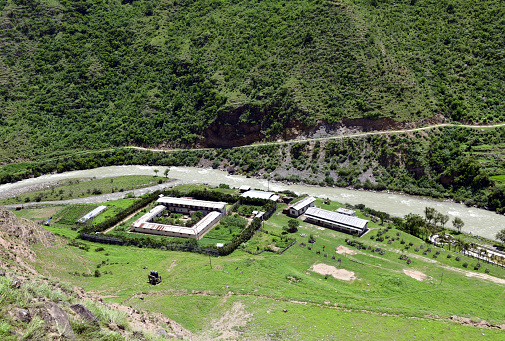 Wangdue Phodrang district, Bhutan: Rabuna Prison, military operated jail on the scenic bank of the Dang Chu river - used to incarcerate criminal and political prisoners in a country known as a pastoral Shangri-La.