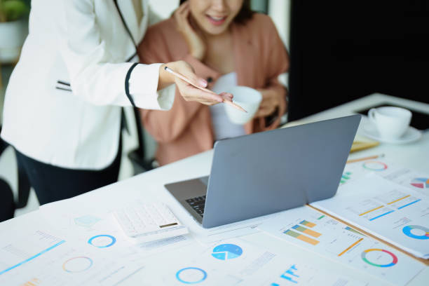 istock Portrait of two female employees using computers during work. 1423025903