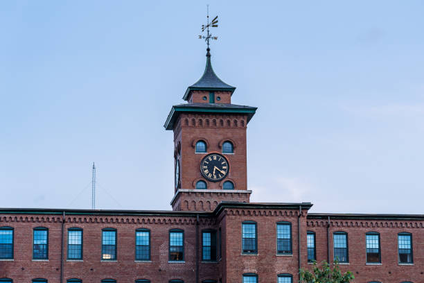 Clock tower at the cotton factory in Nashua, New Hampshire Clock tower at the cotton factory in Nashua, New Hampshire nashua new hampshire stock pictures, royalty-free photos & images
