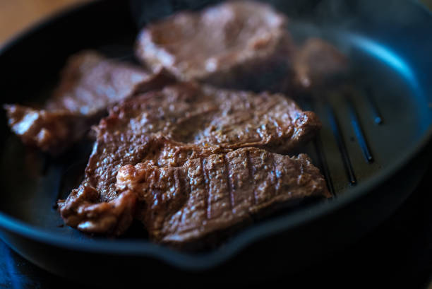 istock Beef steak with pepper is fried in a pan. 1423027882