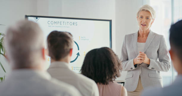 istock Presentation, training and learning on screen in business meeting with female leader for strategy, planning or innovation. Speaker, mentor or ceo in teamwork, competitor coaching and office education 1423028492
