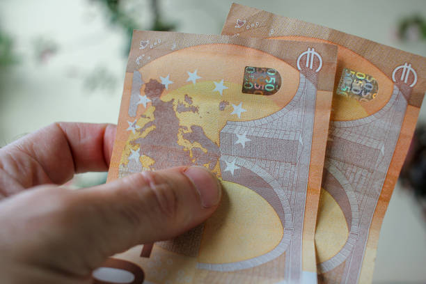 istock two fifty euro banknotes in my hand 1423031133