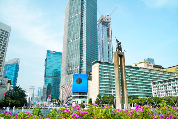 Hotel Indonesia Roundabout Jakarta, Indonesia - August 21, 2022: Cityscape of Hotel Indonesia Roundabout (Bundaran HI) on Thamrin road. traffic circle photos stock pictures, royalty-free photos & images