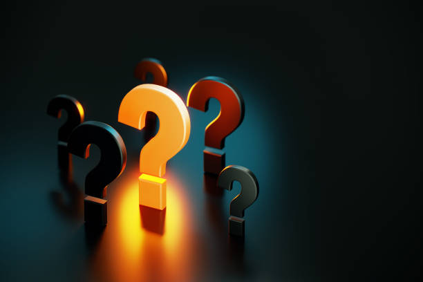 istock Q And A Concept - Yellow Question Mark Glowing Amid Black Question Marks On Black Background 1423031936