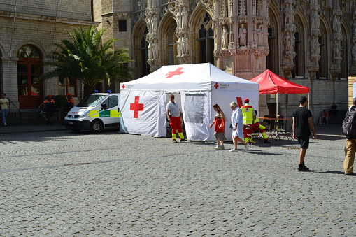 Leuven, Flemish-Brabant, Belgium - September 05, 2022: red cross tent installed at the square Grote Markt Leuven during the animal and food market on Manday
