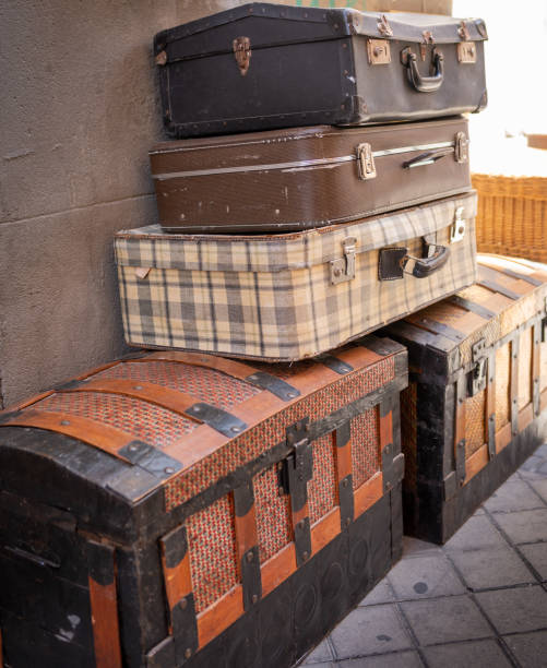 istock Old trunks and stacked suitcases of treated leather. 1423033454