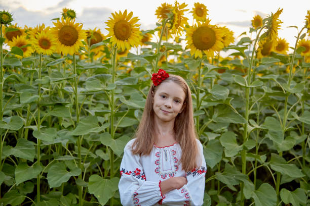 istock girl in sunflowers 1423034355