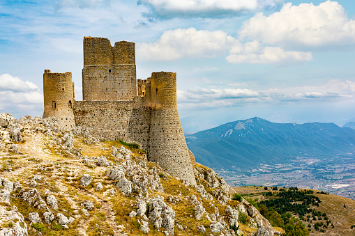 Rocca Calascio, Italy - August 11, 2022: The Castle of Rocca Calascio is a mountain top fortress or rocca  in the Province of L'Aquila, Abruzzo, central Italy, Europe. Located in the Gran Sasso e Monti della Laga National Park. Panoramic view.