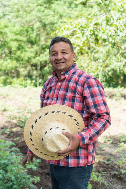 istock Portrait of a farmer standing in a field 1423035570