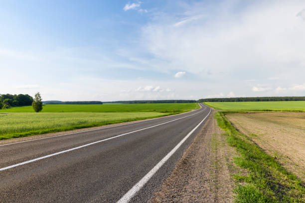 istock paved road for car traffic 1423036645