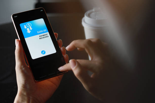 istock Transferring money via mobile banking app 1423040160