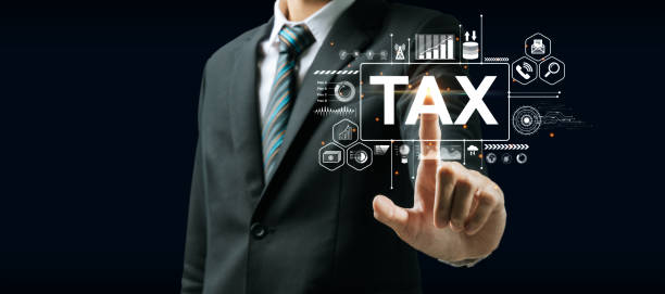 istock businessman hand touching on virtual TAX graphic icon diagram on dark background, document management system, digital marketing, tax online, business finance, internet network technology concept 1423040676