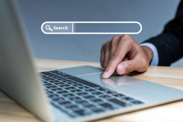 istock businessman hand touching on mobile laptop computer with virtual screen search button, searching browsing information, business finance, internet data technology and data search engine concept 1423040707