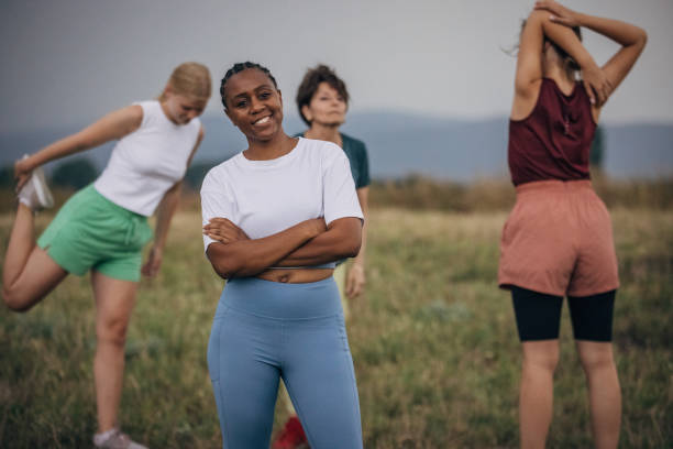 istock Women exercising together in nature 1423040811