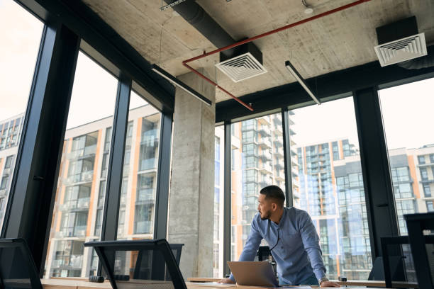 istock Young Asian company employee in his workplace 1423054267
