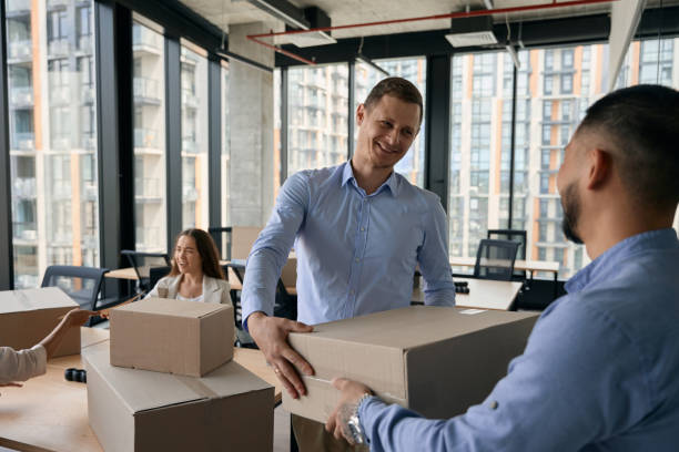 istock Young company staff preparing for office relocation 1423054370