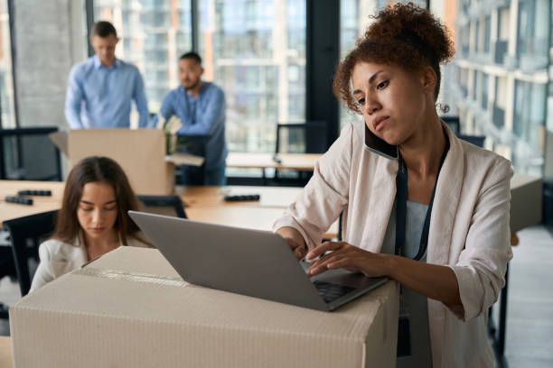 istock Group of corporate employees conducting office relocation 1423054416