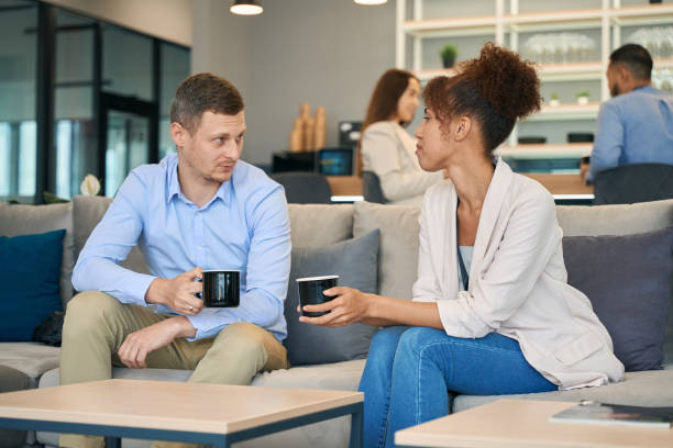 istock Male having conversation with female at coffee break 1423055217