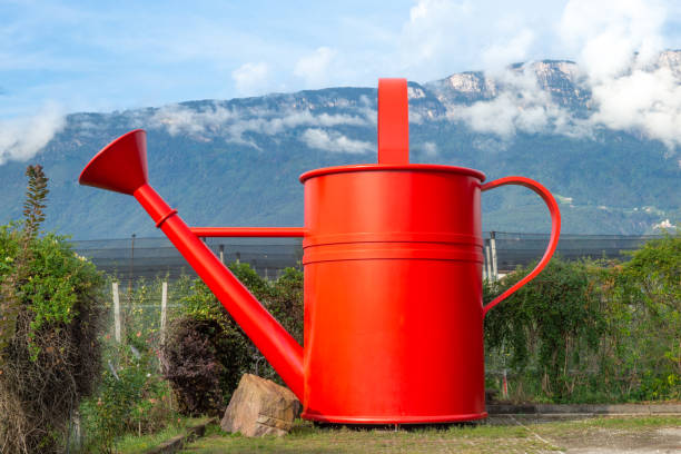object, watering can, very big, sign for a plants nursery, oversized object