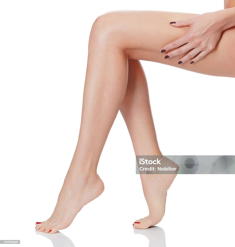 No cellulite Female legs on white background Adult Stock Photo