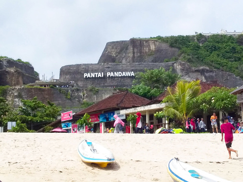 Bali - Indonesia, December 09, 2018 : Pandawa beach in Bali with clean white sand with rubber boats on the beach and several shops and quite iconic Pandawa beach writings